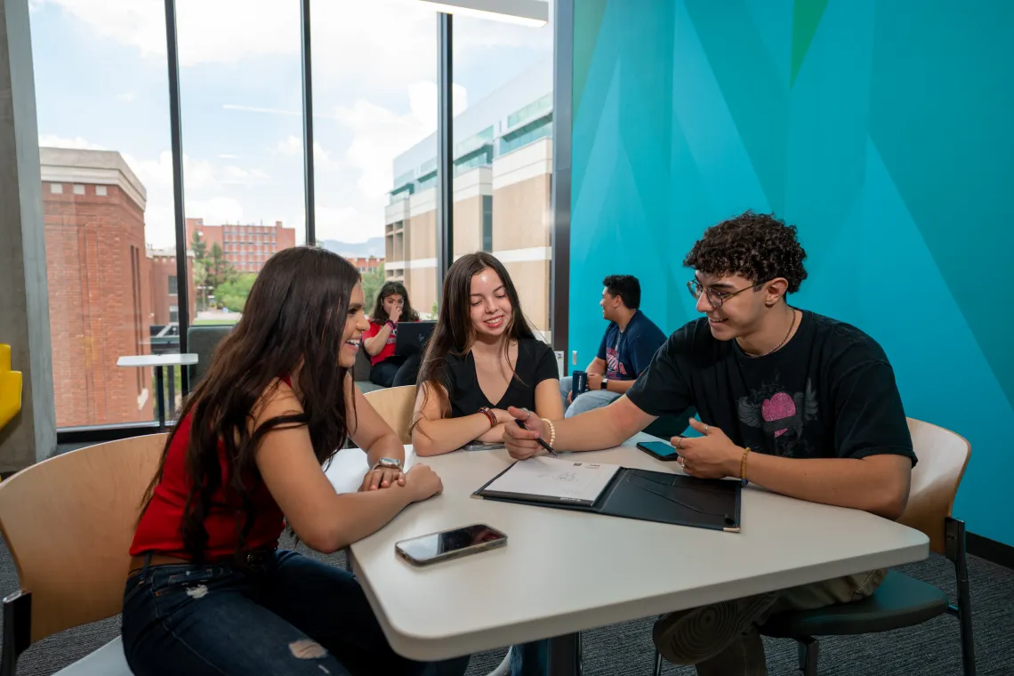 Students sitting around a table in the Student Success District