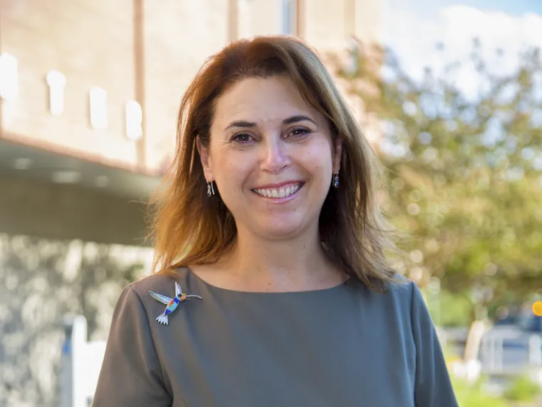 Photo of Gabrielle Miller in front of the SALT Center